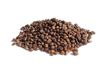  There is a pile of unpeeled pine nuts on a white background.