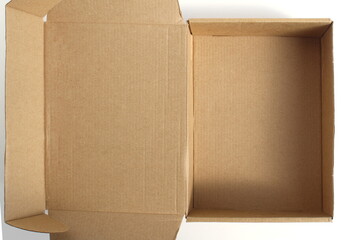 A brown cardboard empty box stands on a white background.