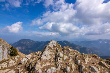 Landscape photo of an uphill climb in spring. Typical landscape in sunshine in the German Alps.