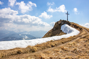 Landscape photo of an uphill climb in spring. Typical landscape in sunshine in the German Alps.
