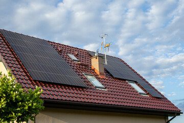 Red-tiled rooftop of a modern house