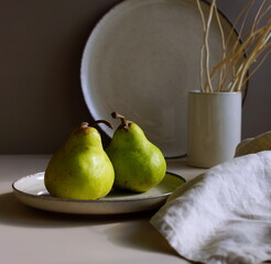 Still life with fruits, minimalist, aesthetic. Grapes and table decor with a moody window light...