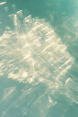 Abstract sunlight shadows background  texture, wallpaper, sun glare monochrome turquoise color....