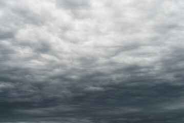 Dramatic overcast sky filled with dense, layered gray clouds before a storm