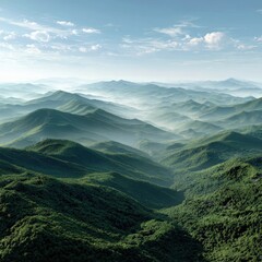 Obraz premium Overhead View of Green Mountain Range with Fog