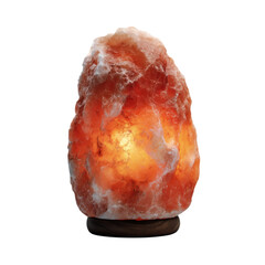 Lit himalayan salt lamp illuminating with warm orange light on a wooden base.
