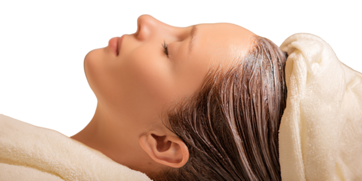 Caucasian woman relaxing with hair mask treatment and towel wrap in spa Concept of beauty, wellness, selfcare, and pampering for healthy hair - Powered by Adobe