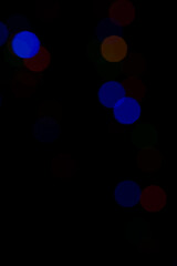 Defocused colorful lights in darkness
