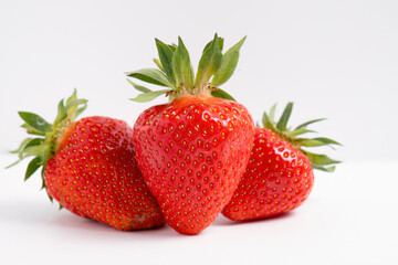 Ripe strawberries on white background
