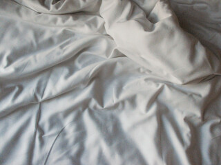 White blanket crumpled textile background messy. Fabric cotton background