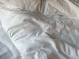 White blanket crumpled textile background messy. Fabric cotton background
