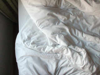 White blanket crumpled textile background messy. Fabric cotton background