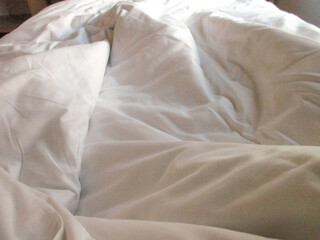 White blanket crumpled textile background messy. Fabric cotton background