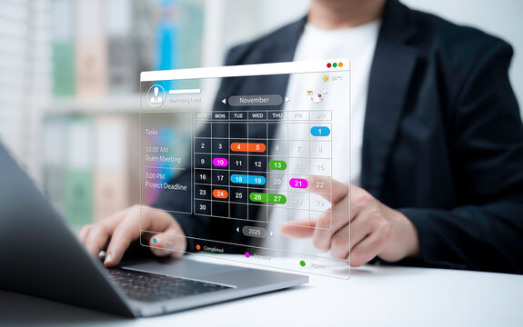 Businessman managing schedule using digital calendar interface on laptop with touch control for task planning meeting deadline event reminder timeline management productivity workspace