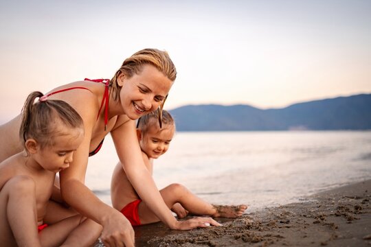 Summer joy at the beach with playful children in Greece