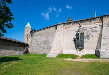 A view of the Pskov Kremlin fortress wall by Percy and Installation with a sword in honor of the victory over the Livonians in the Battle of the Icei, Pskov, Russia.