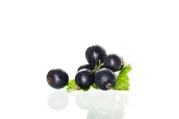 some blackcurrant berries isolated on white background