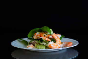 Fresh vegetable salad with shrimps and cucumbers