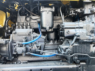 A detailed, close-up view of a robust diesel engine, showcasing its complex mechanics, various...