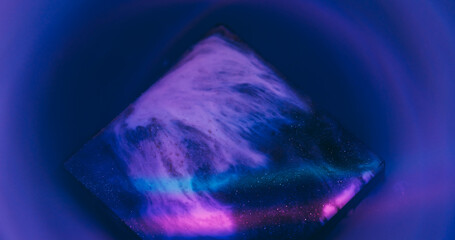Cube ink splash. Neon texture. Defocused purple blue yellow colorful geometric rainbow sparkling...