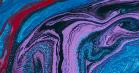 Splatter art. Paint fluid. Defocused blue purple red color chemical splash particles flowing on...