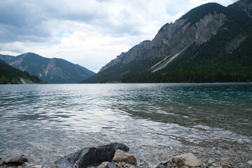 Scenic alpine lake surrounded by dramatic mountain landscape