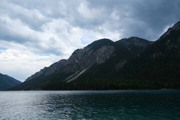 Scenic alpine lake surrounded by dramatic mountain landscape