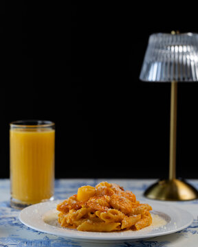 Pasta and a orange juice in restaurant