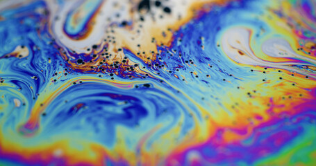 Rainbow oil. Paint mix. Multicolor gasoline liquid vivid vibrant wave blend pigment background....
