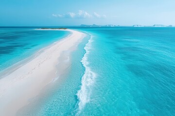 Tranquil beach with turquoise waters and pristine sand under a clear blue sky