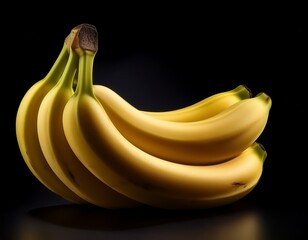 four ripe yellow bananas clustered together against a black background showcasing their curves and subtle shadows