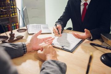 Businessmen consult with lawyers, submit additional documents, and pay for lawyers' services. After...