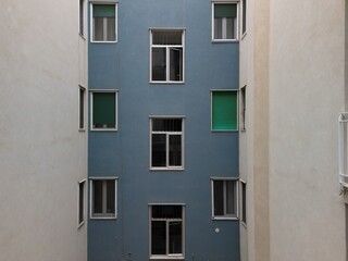 drone view of building with green windows and shutters
