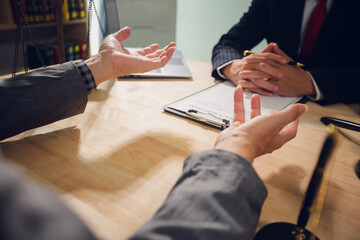 Businessmen consult with lawyers, submit additional documents, and pay for lawyers' services. After...