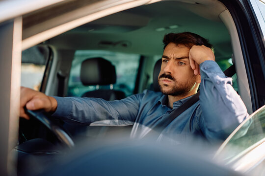 Displeased driver stuck in traffic jam.