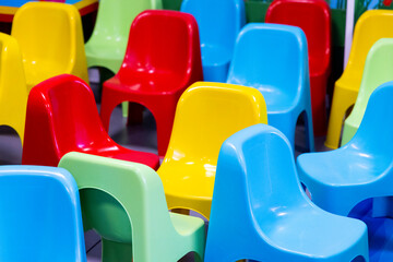 colored plastic chairs used in playrooms during children's parties