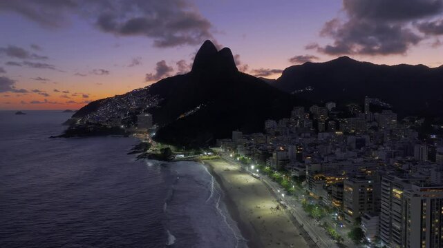 Aerial view of famous Ipenema Beach and Morro Dois Irmaos at twilight in Rio de Janeiro, Brazil. 
