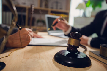 Businessmen consult with lawyers, submit additional documents, and pay for lawyers' services. After...