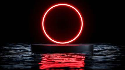 Red circle is floating in the water. The circle is surrounded by a dark background. The image has a mysterious and surreal feel to it