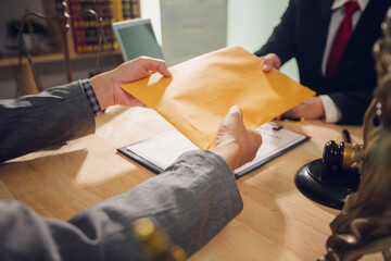 Businessmen consult with lawyers, submit additional documents, and pay for lawyers' services. After...