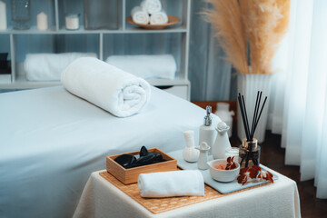 Exquisite display of beauty treatment and spa salon accessories arranged on spa table in luxury spa resort. Relaxing spa massage and recreation background concept. Quiescent