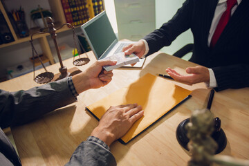 Businessmen consult with lawyers, submit additional documents, and pay for lawyers' services. After...