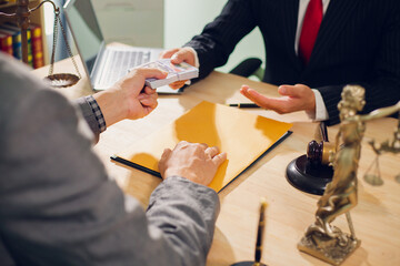 Businessmen consult with lawyers, submit additional documents, and pay for lawyers' services. After...