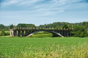 Abandoned Concrete Bridge in Sāti, Latvia - Historic Landmark in Verdant Countryside