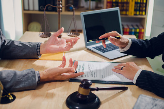Businessmen consult with lawyers, submit additional documents, and pay for lawyers' services. After reaching an agreement and signing the contract, the two shake hands. Concept, Justice, and Lawyers