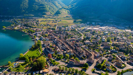 A panoramic aerial view around the old town of the city Villeneuve in Switzerland on a sunny spring...