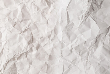 Crumpled white paper background.