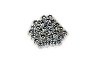 A group of metal nuts isolated on a white background.