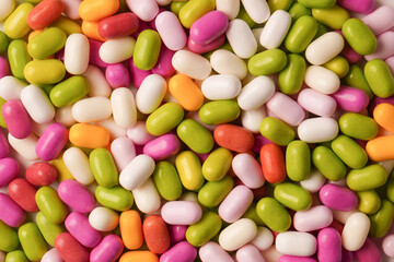Sweet multicolored candies isolated on white background.