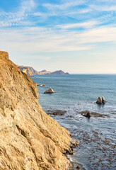 Dramatic landscape with the rocky coastline of the Pacific ocean in Paracas National Reserve, Peru.